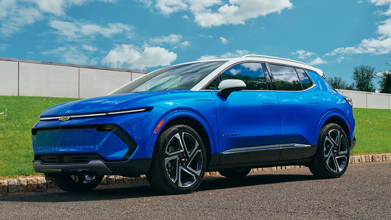 A 2026 Chevrolet Equinox EV, in side profile, parked on a street