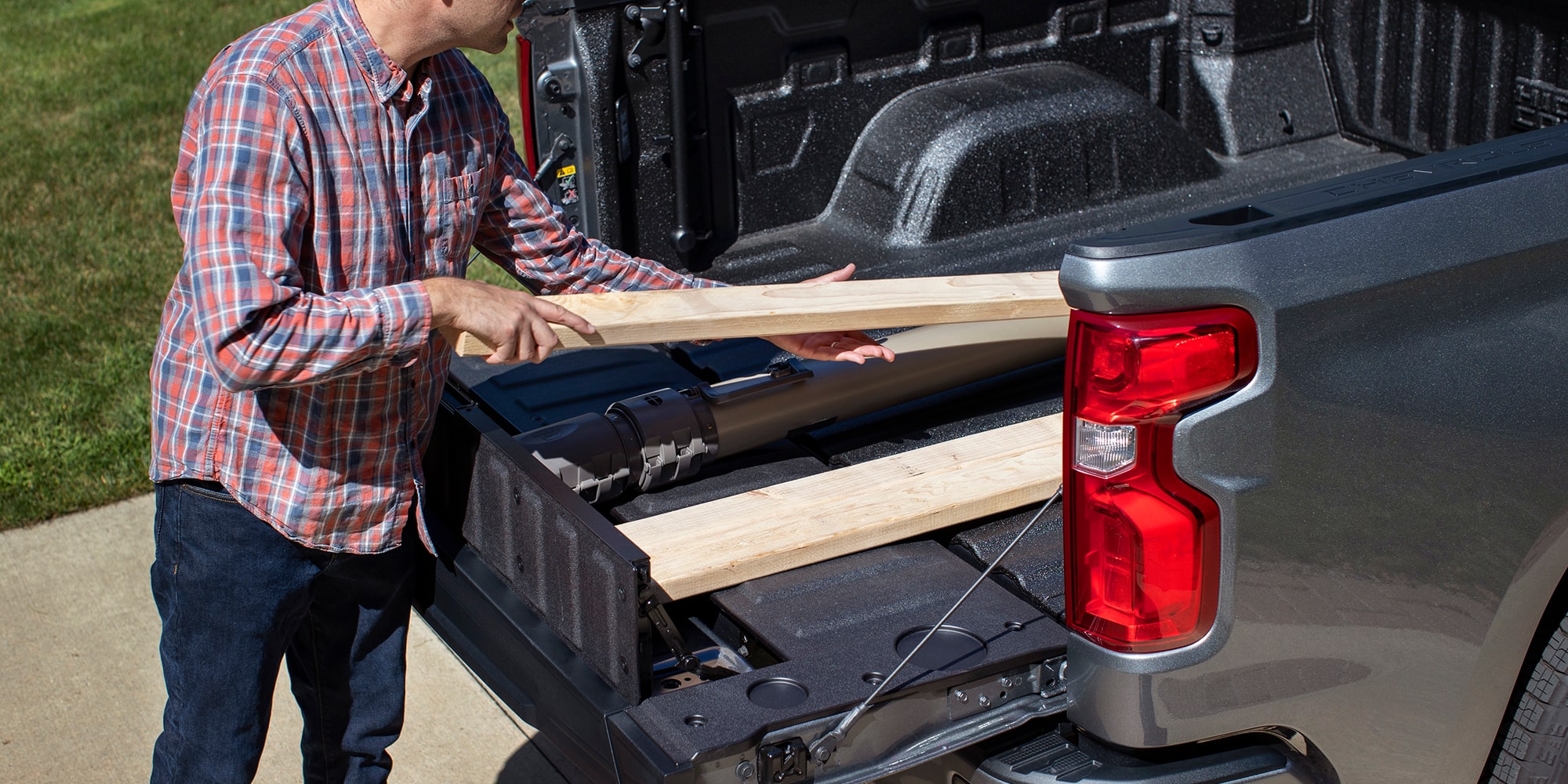 A white 2026 Chevrolet Silverado EV viewed from the rear
