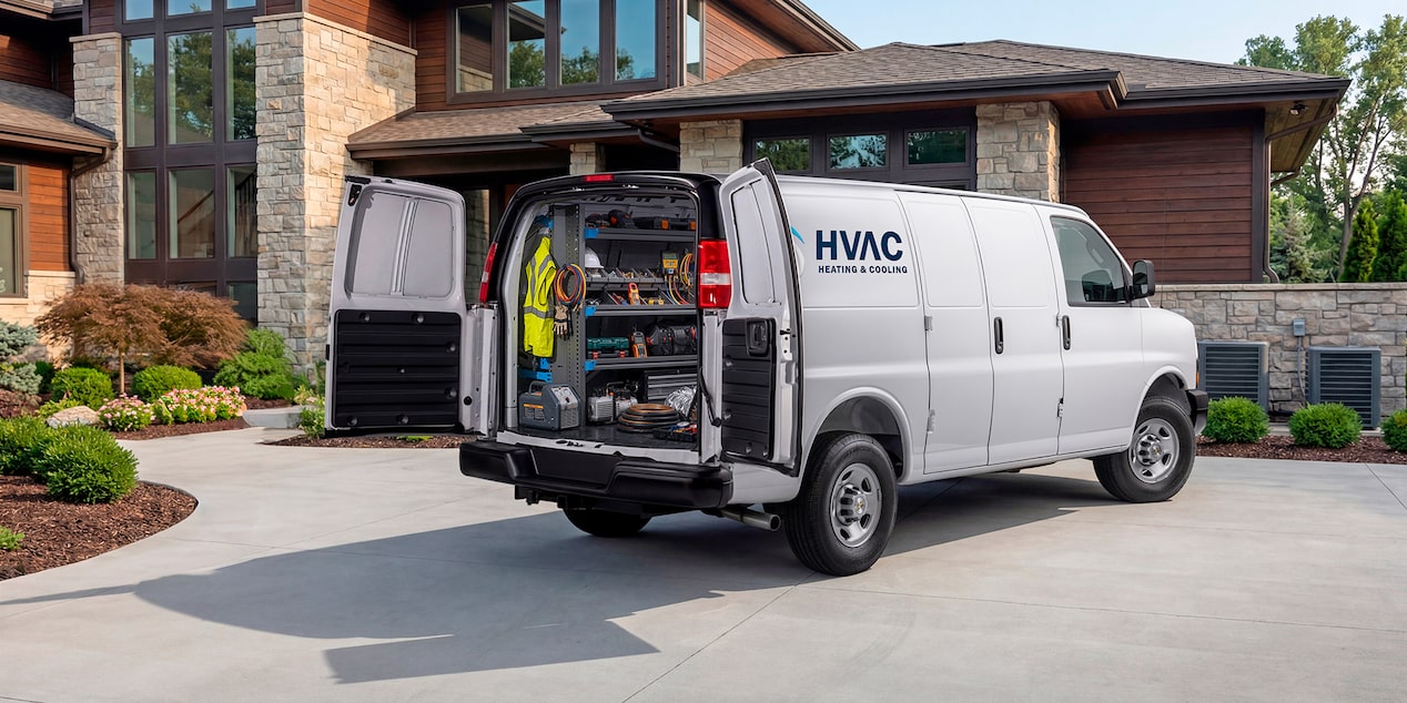 A white Chevrolet Express Cargo Van customized for HVAC