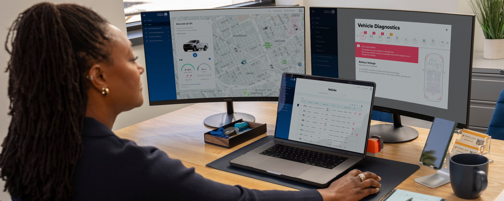 GM Fleet Telematics on 2 monitors and an laptop