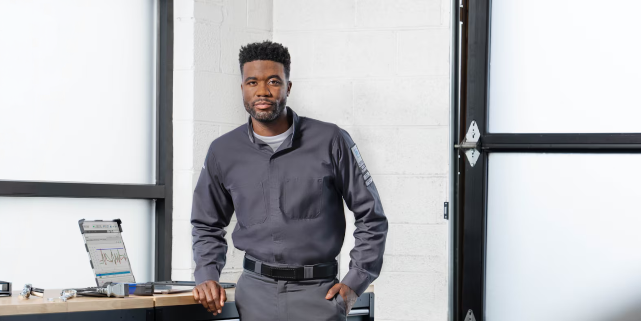 A GM Technician Standing Next to a Work Bench