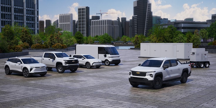 A fleet of various GM Fleet vehicles parked  on a job site.