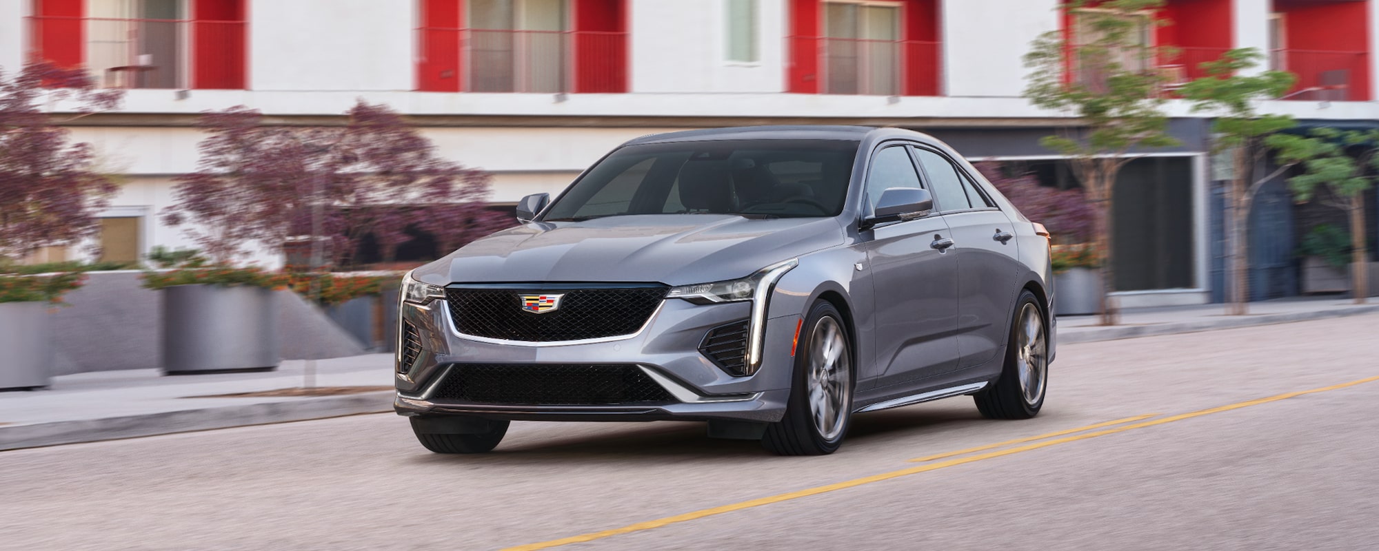 A Cadillac CT5 sedan driving down the road.