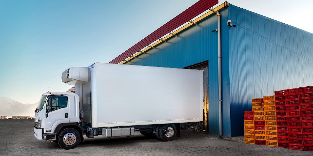 A cab forward Chevrolet Reefer truck at a loading dock