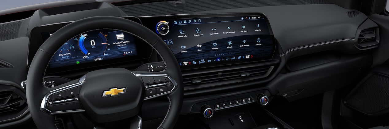 A full interior shot of the dashboard of a 2026  Silverado EV including the steering wheel, infotainment center, and passenger controls.