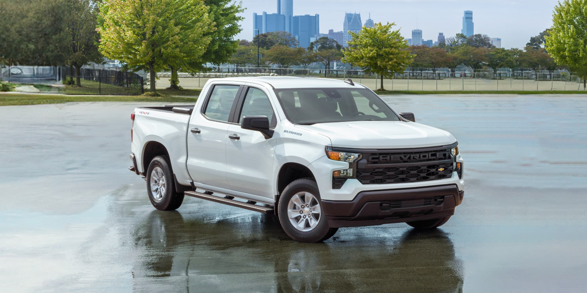 A white 2026 Chevrolet Silverado EV viewed from the rear