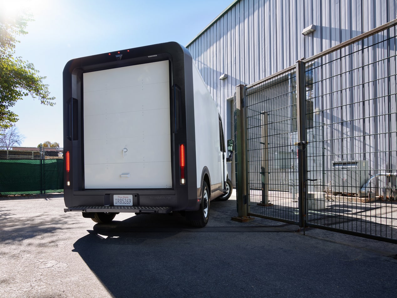 The rear of a 2025 BrightDrop as it pulls into a warehouse.