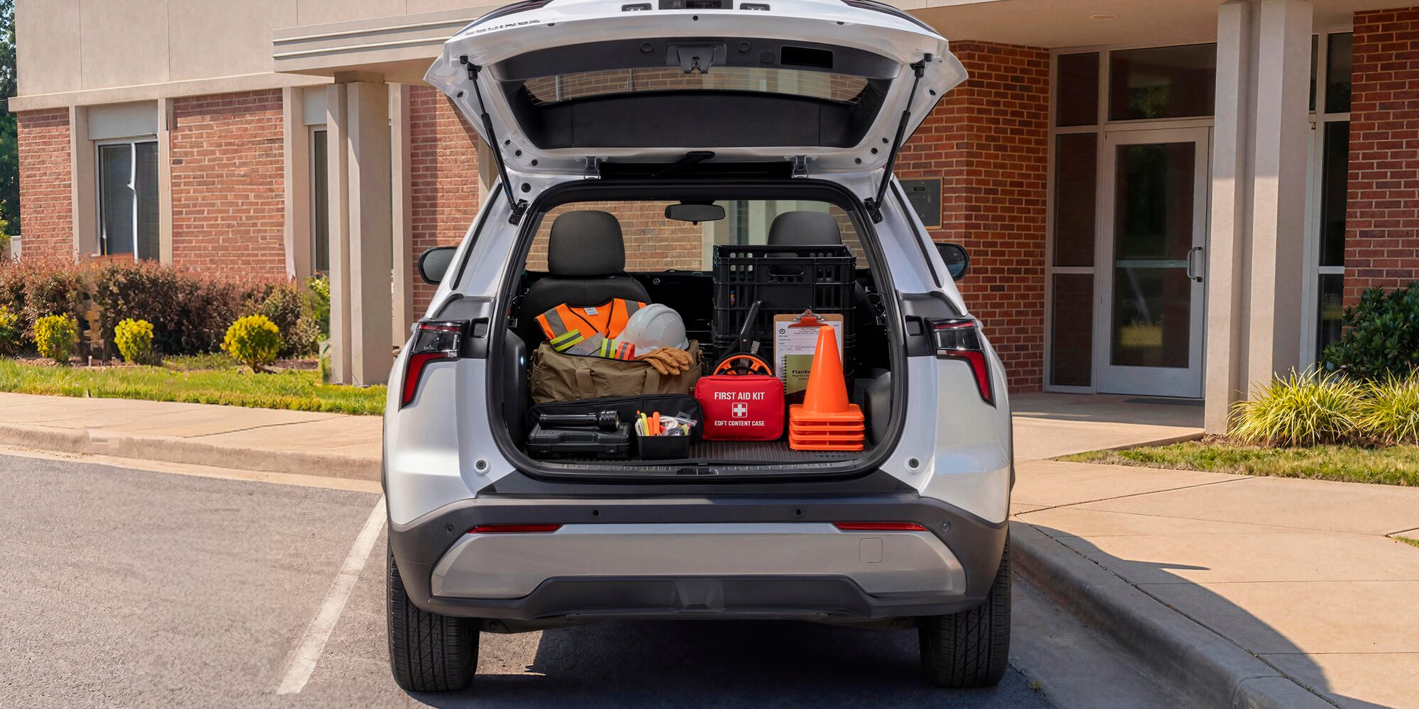 The trunk of a Chevrolet Equinox loaded with construction equipment. 