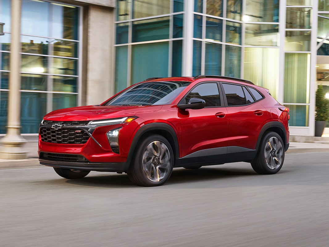 A 2026 Chevrolet Trax parked in three-quarter view in front of a building