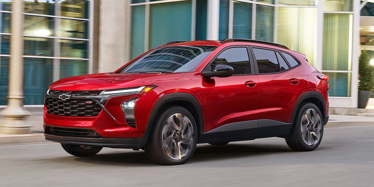 A 2026 Chevrolet Trax parked in three-quarter view in front of a building