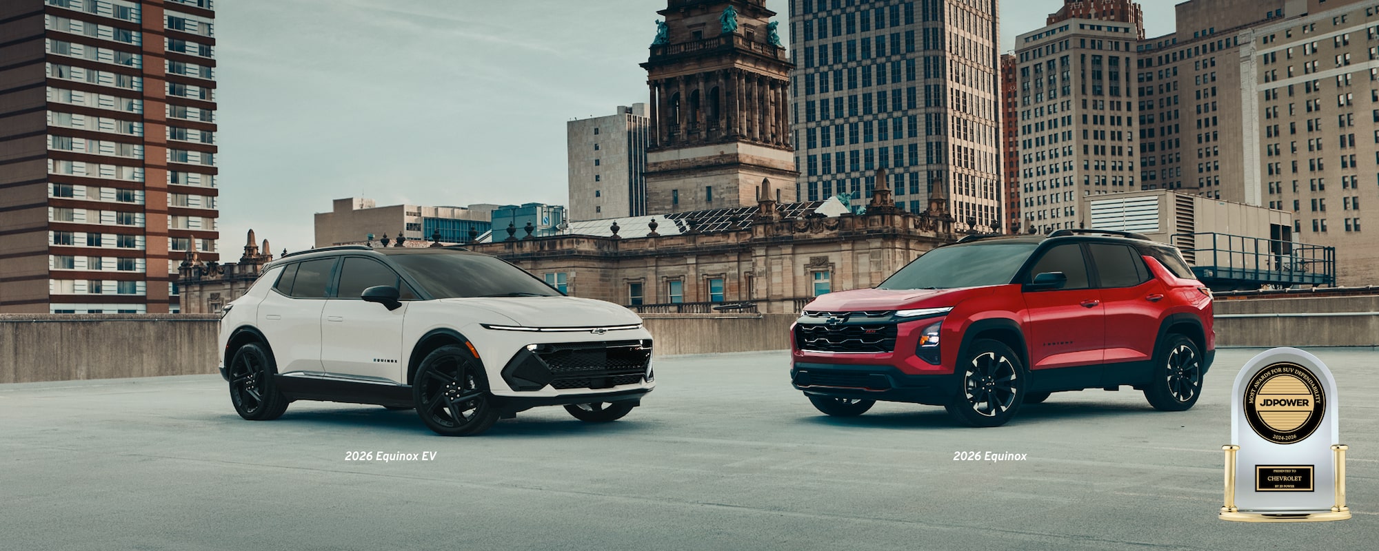Two Chevrolet SUVs parked in a city with a JD Power award in the bottom right corner. 