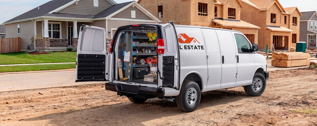 A white Chevrolet Express Cargo Van customized for construction
