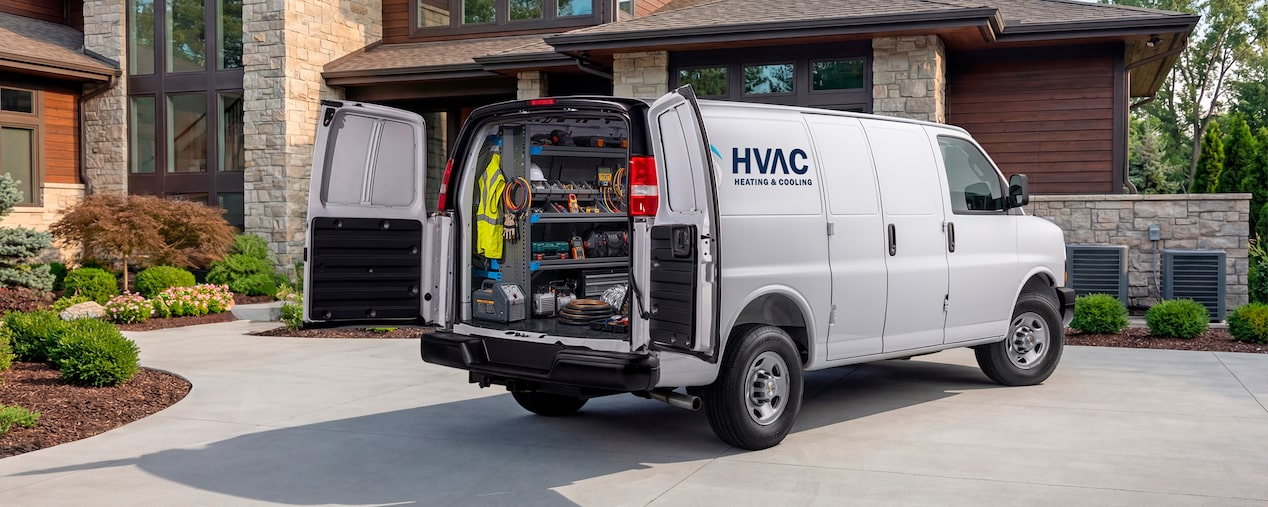 A white Chevrolet Express Cargo Van customized for HVAC