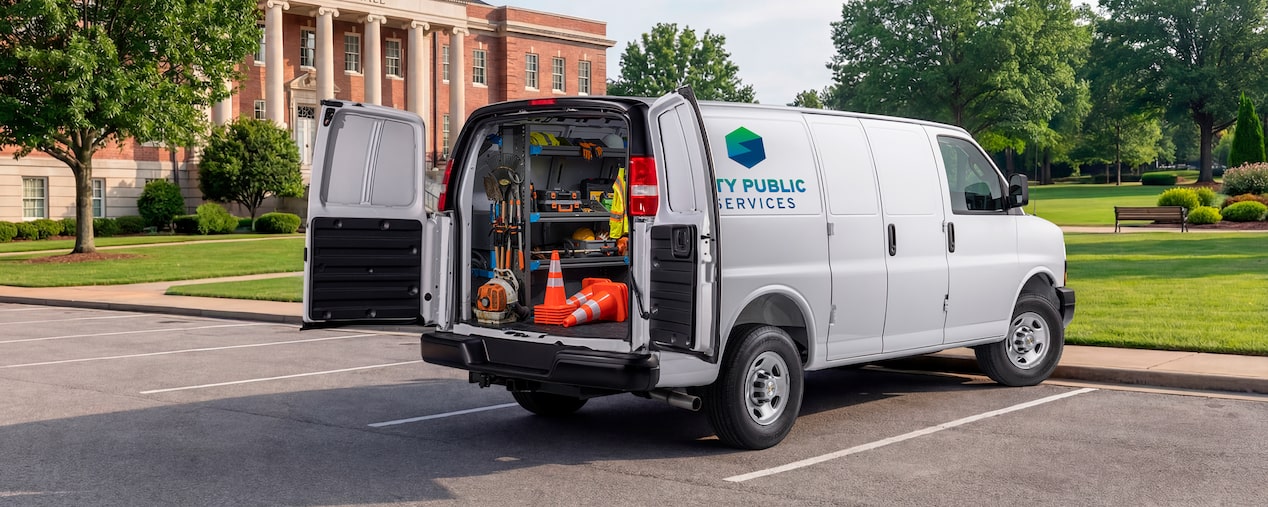 A white Chevrolet Express Cargo Van customized for public works.