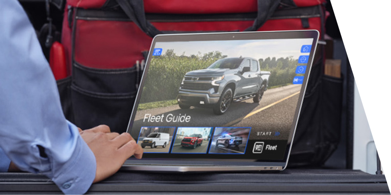 Hands Type on a Laptop With Text "Fleet Guide" on the Screen