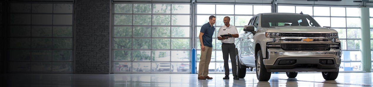 A customer being shown a 2024 Chevy Silverado
