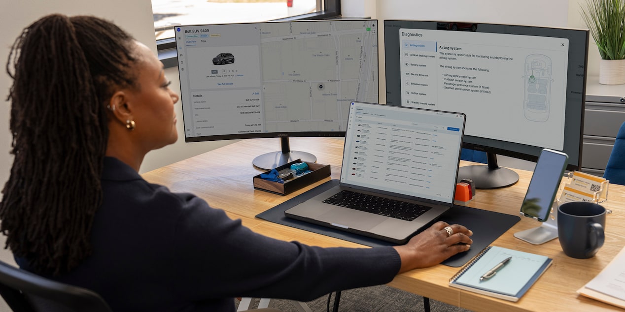 An office worker using GM Fleet OnStar Fleet Telematics.