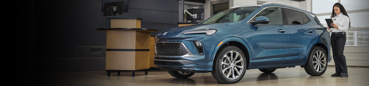 A Buick SUV being examined by a support specialist