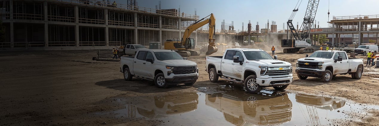 Three GM Fleet Trucks, both Chevrolet and GMC, parked on a jobsite.