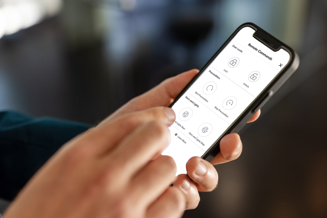 Someone using the OnStar app from their phone