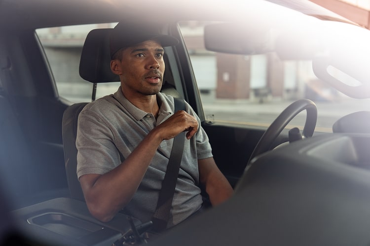 A driver utilizing the OnStar auto crash response feature