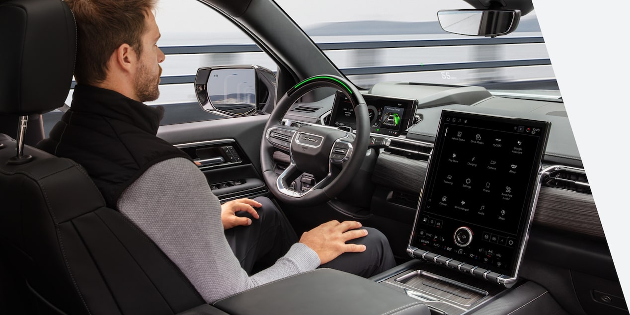 A driver utilizing GM Fleet Super Cruise hands free driving.