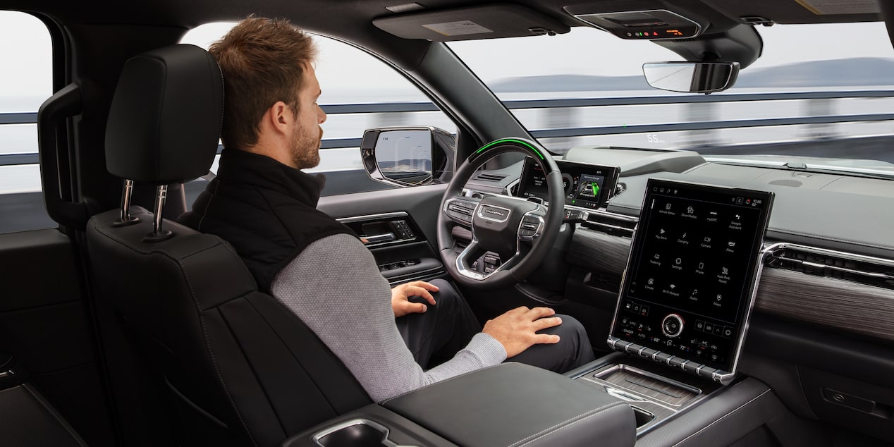 A driver utilizing GM Fleet Super Cruise hands free driving.