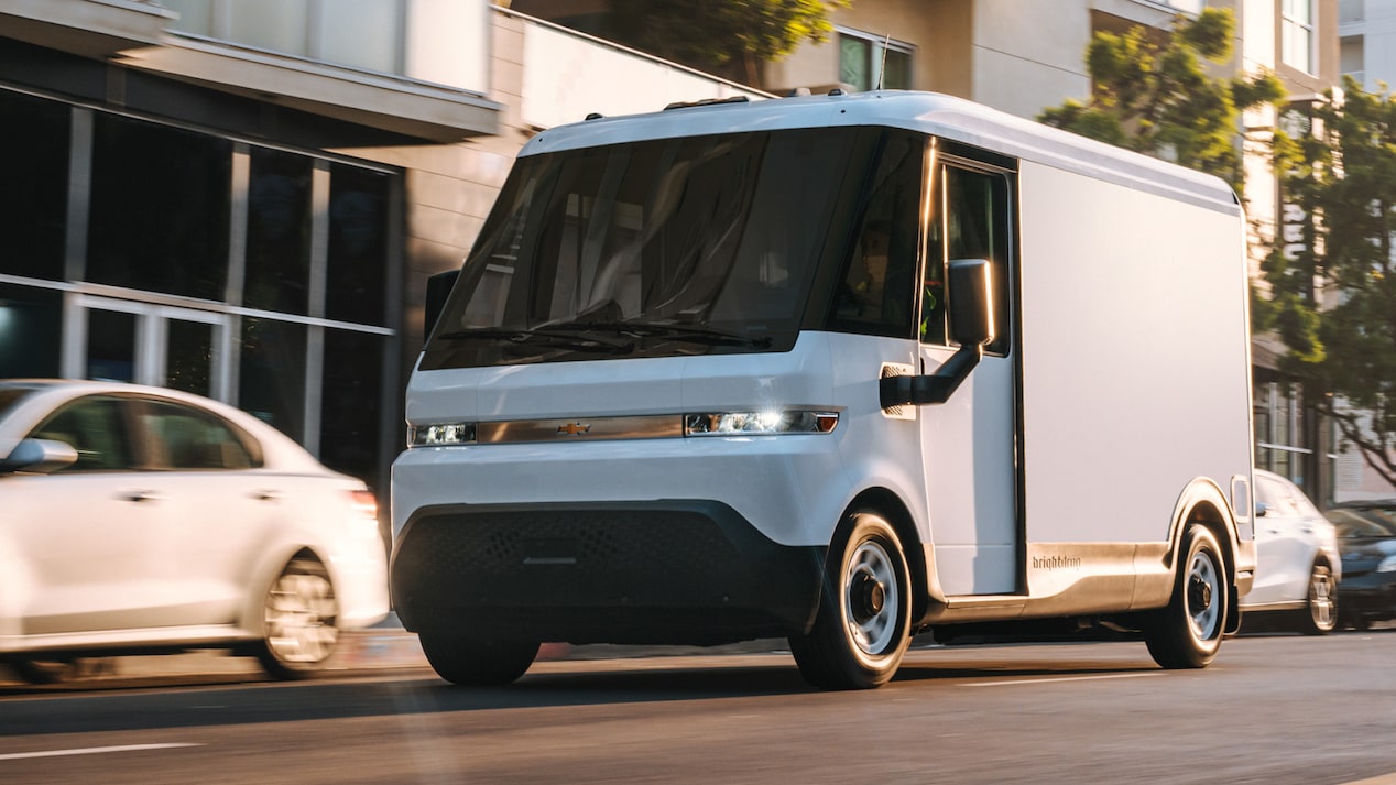 A white Chevrolet BrightDrop driving down the road. 