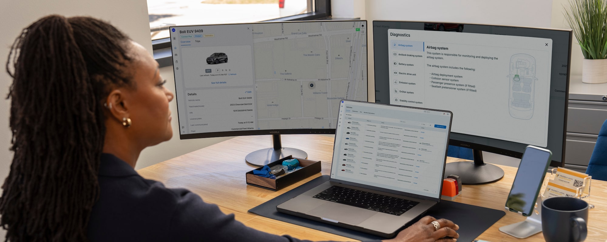 GM Fleet Telematics on 2 monitors and an laptop