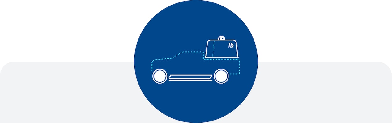 an icon of a pickup truck with a large weight in the bed.