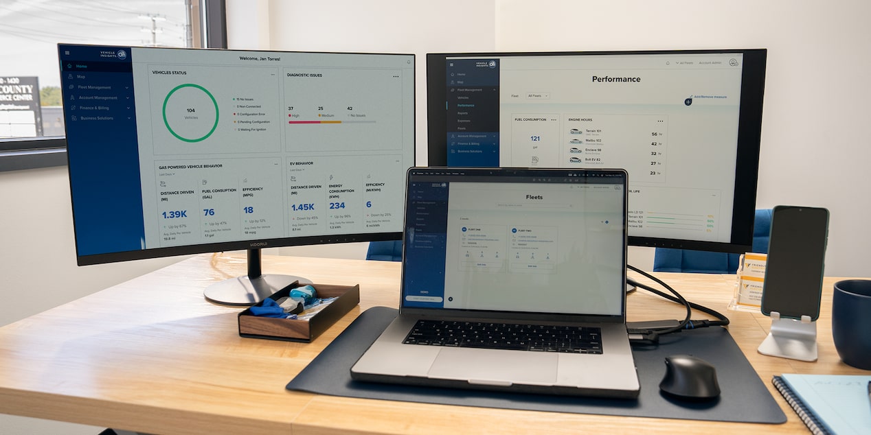 GM Fleet Telematics on 2 monitors and an laptop