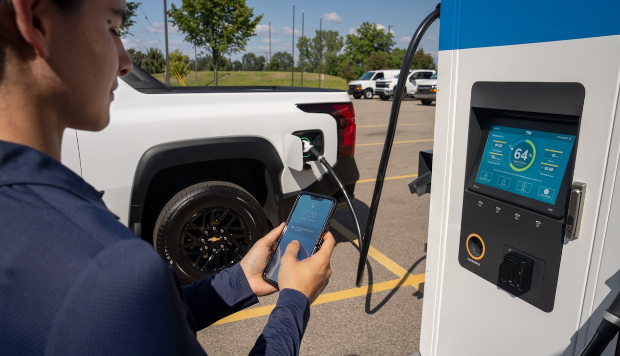 A Chevrolet Silverado EV plugged into an EV charger.