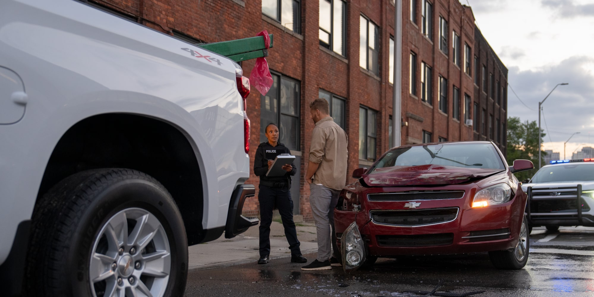 A police officer speaking with a driver that had crashed their car. 